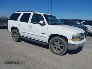 2002 Chevrolet Tahoe LS z VIN 1GNEC13Z32R148792, wystawiony jako IAAI lot #38599251 z przebiegiem 333 537 mil mil oraz . Historia ofert i sprzedaży dostępna na DreamBid. Obrazek 1.