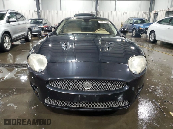 2007 Jaguar XK with VIN SAJWA43C479B18700, listed as a Copart auction lot 83377684 with 143,746 mi miles and Salvage Title. Bid and sale history available at carsss.com. Image 5.