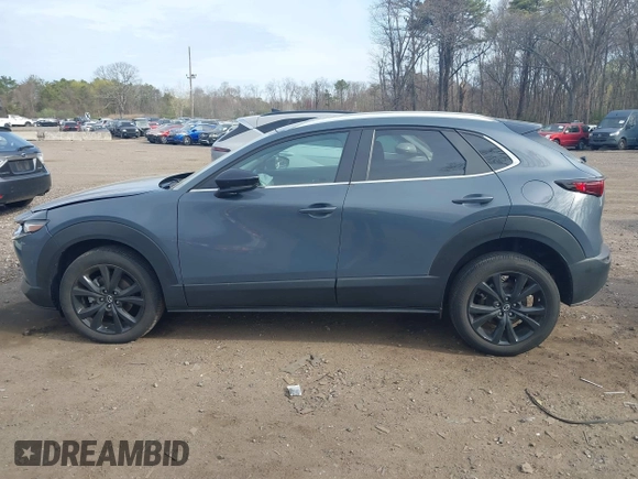 2023 Mazda CX-30 S Carbon Edition with VIN 3MVDMBCM8PM502891, listed as a IAAI auction lot 42050533 with 20,035 mi miles and . Bid and sale history available at DreamBid. Image 14.