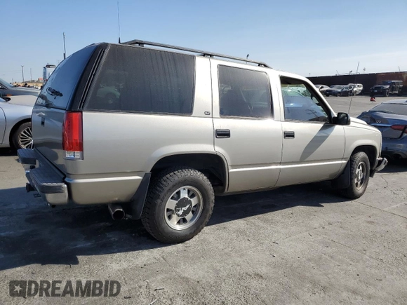 1999 GMC Yukon with VIN 1GKEC13R9XJ704929, listed as a Copart auction lot 89097295 with 87,478 mi miles and Salvage Title. Bid and sale history available at carsss.com. Image 3.