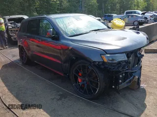 2018 Jeep Grand Cherokee SRT z VIN 1C4RJFDJ1JC437659, wystawiony jako IAAI lot #40365265 z przebiegiem 53 541 mil mil oraz . Historia ofert i sprzedaży dostępna na DreamBid. Obrazek 1.