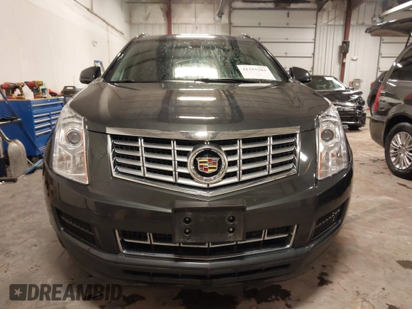 2014 Cadillac SRX with VIN 3GYFNAE34ES665630, listed as a IAAI auction lot 41315281 with 99,009 mi miles and . Bid and sale history available at DreamBid. Image 12.