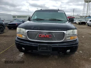 2003 GMC Yukon Denali z VIN 1GKEK63U43J263449, wystawiony jako Copart lot #53848345 z przebiegiem 144 280 mil mil oraz Szkody całkowita. Historia ofert i sprzedaży dostępna na DreamBid. Obrazek 5.