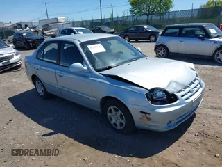 2005 Hyundai Accent GLS with VIN KMHCG45C75U658672, listed as a IAAI auction lot 42107140 with 34,351 mi miles. Bid and sale history available at carsss.com. Image 1.