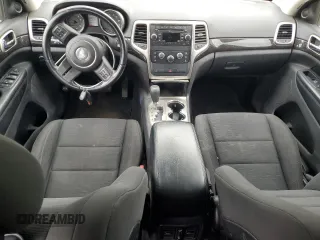 2011 Jeep Grand Cherokee Laredo with VIN 1J4RR4GG9BC515467, listed as a Copart auction lot 58411085 with 112,558 mi miles and Salvage title. Bid and sale history available at DreamBid. Image 8.