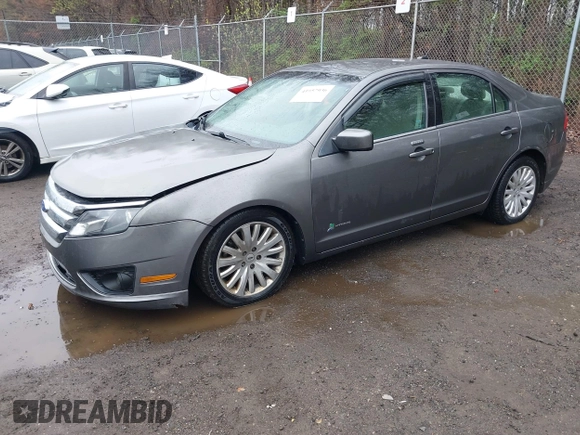 2012 Ford Fusion Hybrid with VIN 3FADP0L34CR215667, listed as a IAAI auction lot 41957936 with 158,914 mi miles and . Bid and sale history available at DreamBid. Image 2.