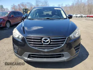 2016 Mazda CX-5 Sport with VIN JM3KE4BY8G0749246, listed as a Copart auction lot 52644655 with 117,753 mi miles and Clean Title. Bid and sale history available at carsss.com. Image 5.