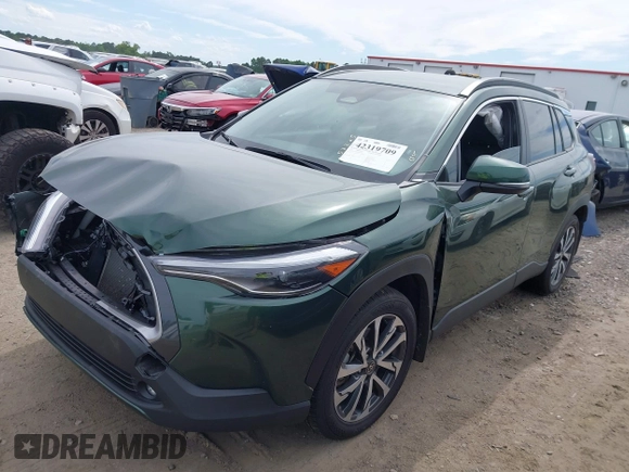 2023 Toyota Corolla Cross XLE with VIN 7MUEAAAG9PV053569, listed as a IAAI auction lot 42319709 with 71,105 mi miles and . Bid and sale history available at DreamBid. Image 2.