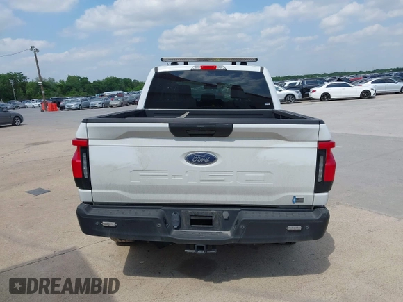 2023 Ford F-150 Lightning Pro with VIN 1FTVW1EL2PWG18764, listed as a IAAI auction lot 41908278 with 16,276 mi miles and . Bid and sale history available at DreamBid. Image 16.
