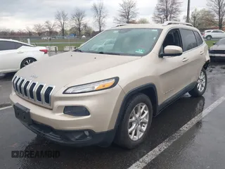 2014 Jeep Cherokee Latitude with VIN 1C4PJLCB8EW191911, listed as a IAAI auction lot 41956728 with 123,643 mi miles. Bid and sale history available at carsss.com. Image 2.