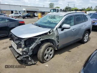 2021 Toyota RAV4 XLE with VIN 2T3P1RFVXMC149652, listed as a Copart auction lot 61027435 with 56,102 mi miles and Salvage title. Bid and sale history available at DreamBid. Image 1.
