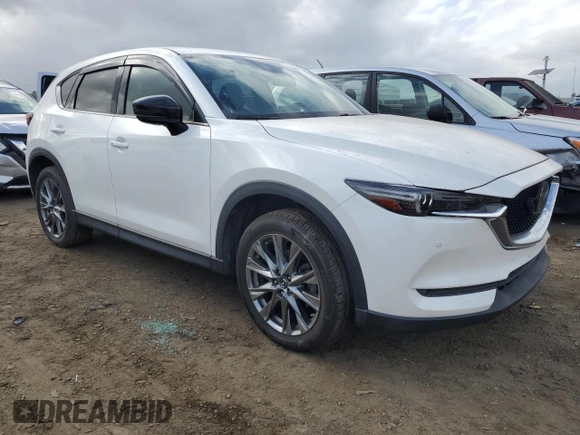 2019 Mazda CX-5 Signature with VIN JM3KFBEYXK0537826, listed as a Copart auction lot 50063015 with 76,448 mi miles and Salvage Title. Bid and sale history available at carsss.com. Image 4.