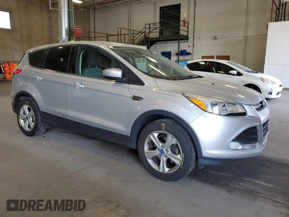 2013 Ford Escape SE with VIN 1FMCU0GXXDUB10035, listed as a Copart auction lot 56817785 with 130,497 mi miles and Salvage title. Bid and sale history available at DreamBid. Image 4.