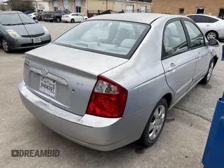 2004 Kia Spectra LX with VIN KNAFE121845043143, listed as a IAAI auction lot 41574523 with 211,758 mi miles. Bid and sale history available at carsss.com. Image 4.