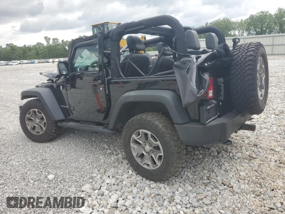 2015 Jeep Wrangler Rubicon with VIN 1C4HJWCG0FL755717, listed as a Copart auction lot 61375435 with 153,207 mi miles and Salvage title. Bid and sale history available at DreamBid. Image 2.
