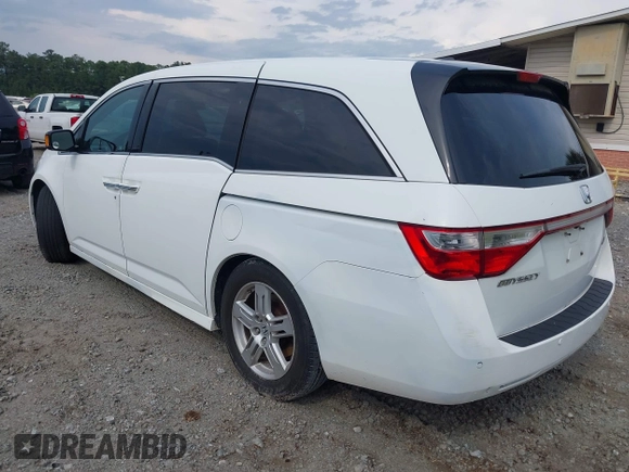 2011 Honda Odyssey Touring with VIN 5FNRL5H90BB066177, listed as a IAAI auction lot 42053368 with 239,205 mi miles and . Bid and sale history available at DreamBid. Image 3.