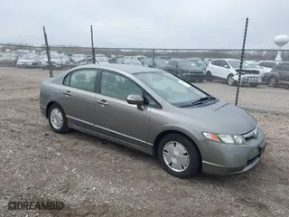 2006 Honda Civic Hybrid with VIN JHMFA36286S006142, listed as a IAAI auction lot 42002933 with 135,182 mi miles. Bid and sale history available at carsss.com. Image 1.