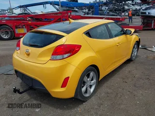 2012 Hyundai Veloster w/Black Int with VIN KMHTC6AD5CU046702, listed as a IAAI auction lot 42245379 with 136,327 mi miles and . Bid and sale history available at DreamBid. Image 4.