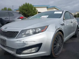 2013 Kia Optima LX with VIN KNAGM4A75D5430974, listed as a IAAI auction lot 41209055 with 197,871 mi miles. Bid and sale history available at carsss.com. Image 6.