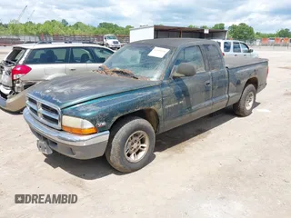 1998 Dodge Dakota SLT with VIN 1B7GL22X4WS554408, listed as a IAAI auction lot 42202021 with 147,765 mi miles. Bid and sale history available at carsss.com. Image 2.