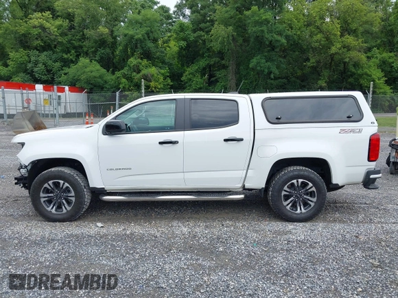 2021 Chevrolet Colorado 4WD Z71 with VIN 1GCGTDEN3M1122062, listed as a IAAI auction lot 42687632 with 52,233 mi miles and . Bid and sale history available at DreamBid. Image 14.