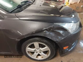 2014 Chevrolet Cruze 1LT with VIN 1G1PC5SBXE7477219, listed as a IAAI auction lot 41970786 with 194,542 mi miles and . Bid and sale history available at DreamBid. Image 12.