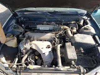 1996 Toyota Camry DX z VIN 4T1BG12K7TU661879, wystawiony jako IAAI lot #42203349 z przebiegiem 213 970 mil mil oraz . Historia ofert i sprzedaży dostępna na DreamBid. Obrazek 10.