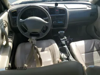 2002 Infiniti G20 Luxury z VIN JNKCP11A12T501940, wystawiony jako Copart lot #74041014 z przebiegiem Nie podano mil oraz Szkody całkowita. Historia ofert i sprzedaży dostępna na DreamBid. Obrazek 8.