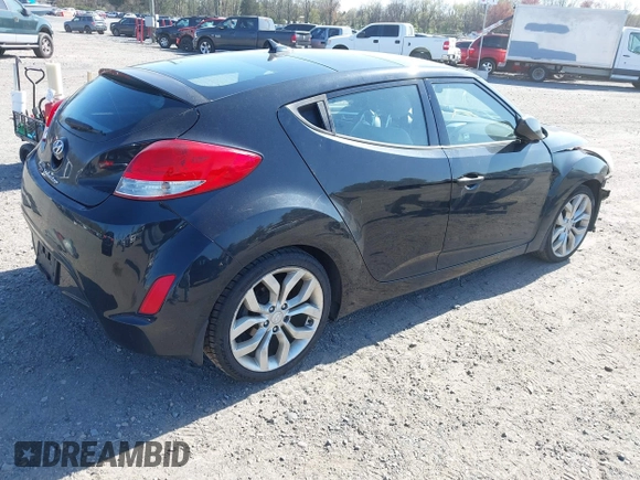 2013 Hyundai Veloster w/Gray Int with VIN KMHTC6AD4DU131242, listed as a IAAI auction lot 42074517 with 76,713 mi miles and . Bid and sale history available at DreamBid. Image 4.