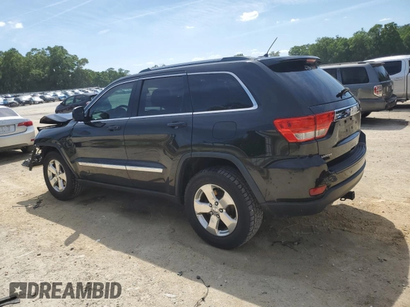 2013 Jeep Grand Cherokee Laredo with VIN 1C4RJEAG2DC519570, listed as a Copart auction lot 52066225 with 129,091 mi miles and Salvage Title. Bid and sale history available at carsss.com. Image 2.