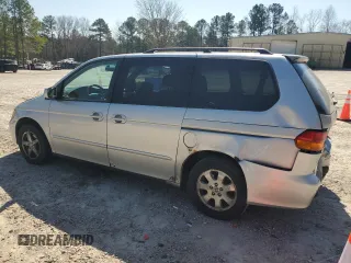 2004 Honda Odyssey EX-L with VIN 5FNRL18974B074613, listed as a Copart auction lot 48924865 with 212,633 mi miles and Salvage Title. Bid and sale history available at DreamBid. Image 2.