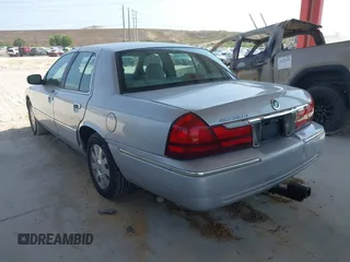 2003 Mercury Grand Marquis LS Premium z VIN 2MEFM75W83X631023, wystawiony jako IAAI lot #42227245 z przebiegiem 114 235 mil mil oraz . Historia ofert i sprzedaży dostępna na DreamBid. Obrazek 3.