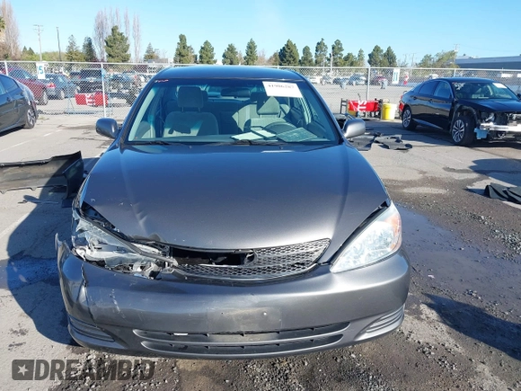 2004 Toyota Camry LE with VIN 4T1BF30K94U577260, listed as a IAAI auction lot 41906287 with 68,499 mi miles. Bid and sale history available at carsss.com. Image 13.