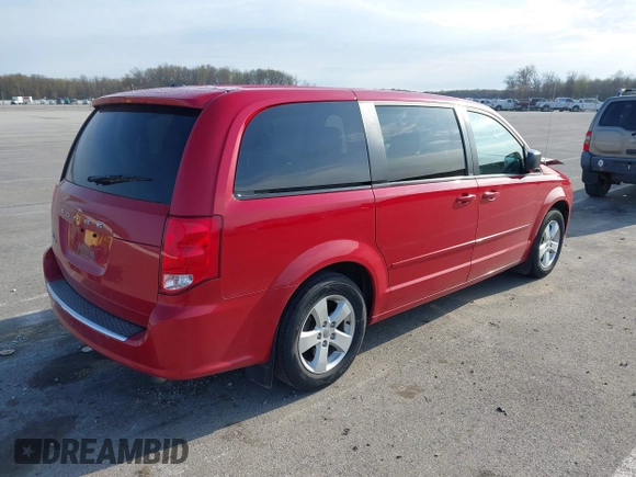 2013 Dodge Grand Caravan SE with VIN 2C4RDGBG9DR723999, listed as a IAAI auction lot 41993367 with 177,549 mi miles and . Bid and sale history available at DreamBid. Image 4.