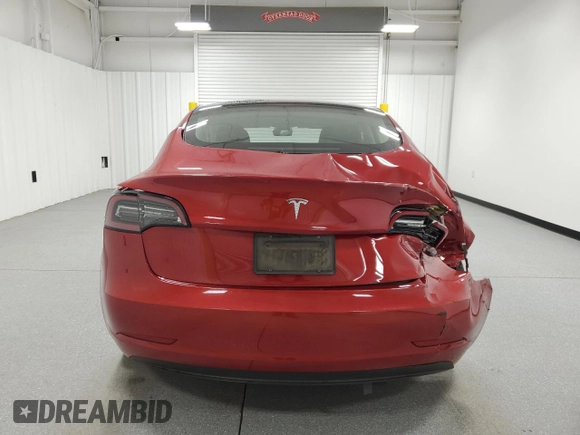 2023 Tesla Model 3 with VIN 5YJ3E1EA6PF455789, listed as a Copart auction lot 54715665 with 64,658 mi miles and Salvage Title. Bid and sale history available at DreamBid. Image 6.