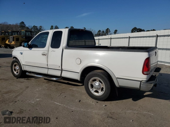 2000 Ford F-150 XL with VIN 1FTRX17L1YNA26050, listed as a Copart auction lot 43597105 with 205,152 mi miles and Salvage Title. Bid and sale history available at carsss.com. Image 2.
