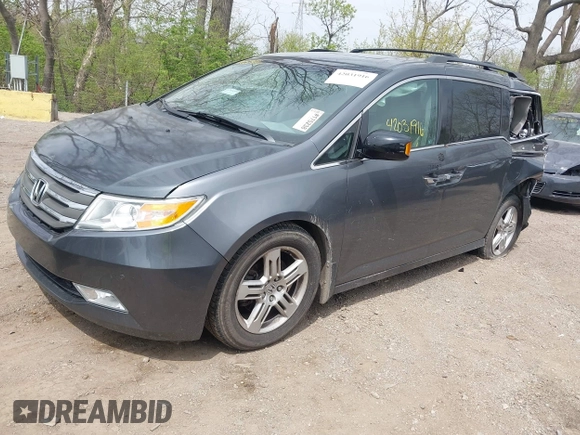2012 Honda Odyssey Touring with VIN 5FNRL5H99CB028304, listed as a IAAI auction lot 42031916 with 216,185 mi miles and . Bid and sale history available at DreamBid. Image 18.