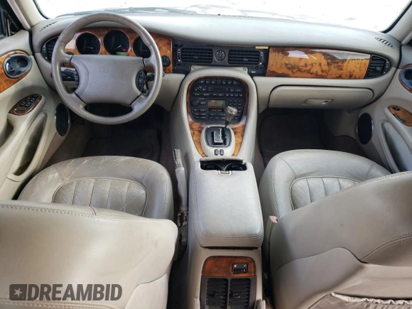 1998 Jaguar XJ with VIN SAJHX1242WC845736, listed as a Copart auction lot 82006044 with 188,785 mi miles and Salvage title. Bid and sale history available at DreamBid. Image 8.