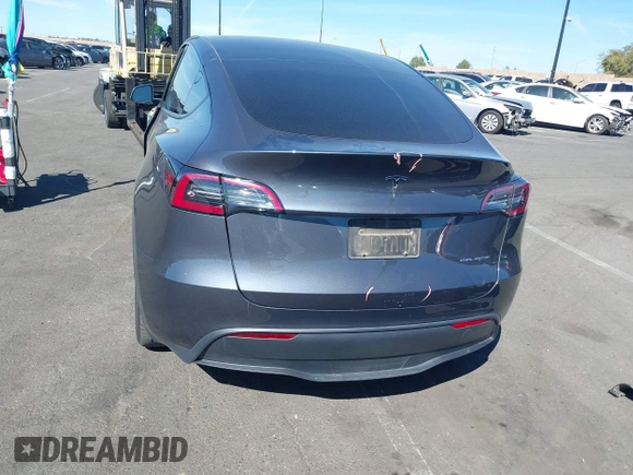 2023 Tesla Model Y Long Range with VIN 7SAYGAEE8PF976969, listed as a IAAI auction lot 41877784 with 25,896 mi miles. Bid and sale history available at carsss.com. Image 17.