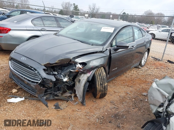 2015 Ford Fusion S Hybrid with VIN 3FA6P0UU7FR167229, listed as a IAAI auction lot 41684934 with 135,317 mi miles. Bid and sale history available at carsss.com. Image 2.