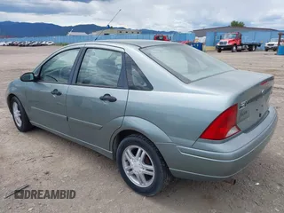 2003 Ford Focus SE z VIN 1FAFP34PX3W135265, wystawiony jako IAAI lot #42354012 z przebiegiem 79 617 mil mil oraz . Historia ofert i sprzedaży dostępna na DreamBid. Obrazek 3.