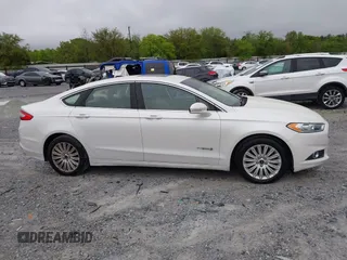 2014 Ford Fusion SE Hybrid with VIN 3FA6P0LU3ER312041, listed as a IAAI auction lot 41964588 with 138,566 mi miles and . Bid and sale history available at DreamBid. Image 13.