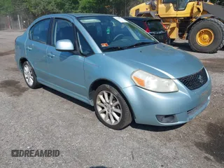 2009 Suzuki SX4 Sport FWD z VIN JS2YC414496204125, wystawiony jako IAAI lot #42384599 z przebiegiem 154 759 mil mil oraz . Historia ofert i sprzedaży dostępna na DreamBid. Obrazek 1.