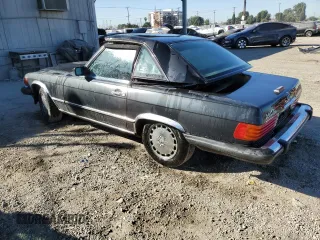 1987 Mercedes-Benz 560 SL with VIN WDBBA48D1HA072141, listed as a Copart auction lot 79715724 with 88,545 mi miles and Salvage Title. Bid and sale history available at DreamBid. Image 2.