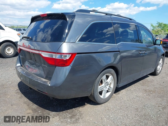 2011 Honda Odyssey Touring Elite with VIN 5FNRL5H96BB043339, listed as a IAAI auction lot 42174767 with 161,233 mi miles and . Bid and sale history available at DreamBid. Image 4.