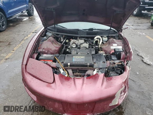 2001 Pontiac Firebird Firebird z VIN 2G2FS22K112122739, wystawiony jako Copart lot #86128074 z przebiegiem 271 969 mil mil oraz Czysty tytuł • Clean title. Historia ofert i sprzedaży dostępna na DreamBid. Obrazek 12.