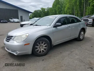 2010 Chrysler Sebring Touring z VIN 1C3CC4FB3AN203543, wystawiony jako Copart lot #57767985 z przebiegiem 152 951 mil mil oraz Szkoda całkowita • Salvage title. Historia ofert i sprzedaży dostępna na DreamBid. Obrazek 1.