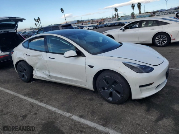 2023 Tesla Model 3 with VIN 5YJ3E1EA7PF579683, listed as a Copart auction lot 87651765 with 9,048 mi miles and Salvage Title. Bid and sale history available at carsss.com. Image 4.