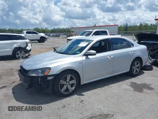 2015 Volkswagen Passat 1.8T Limited Edition with VIN 1VWAT7A35FC109653, listed as a IAAI auction lot 41917568 with 118,912 mi miles. Bid and sale history available at carsss.com. Image 2.