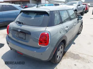 2021 MINI Hardtop 4 Door Oxford Edition with VIN WMWXU7C09M2P17351, listed as a IAAI auction lot 42330197 with 51,628 mi miles and . Bid and sale history available at DreamBid. Image 4.
